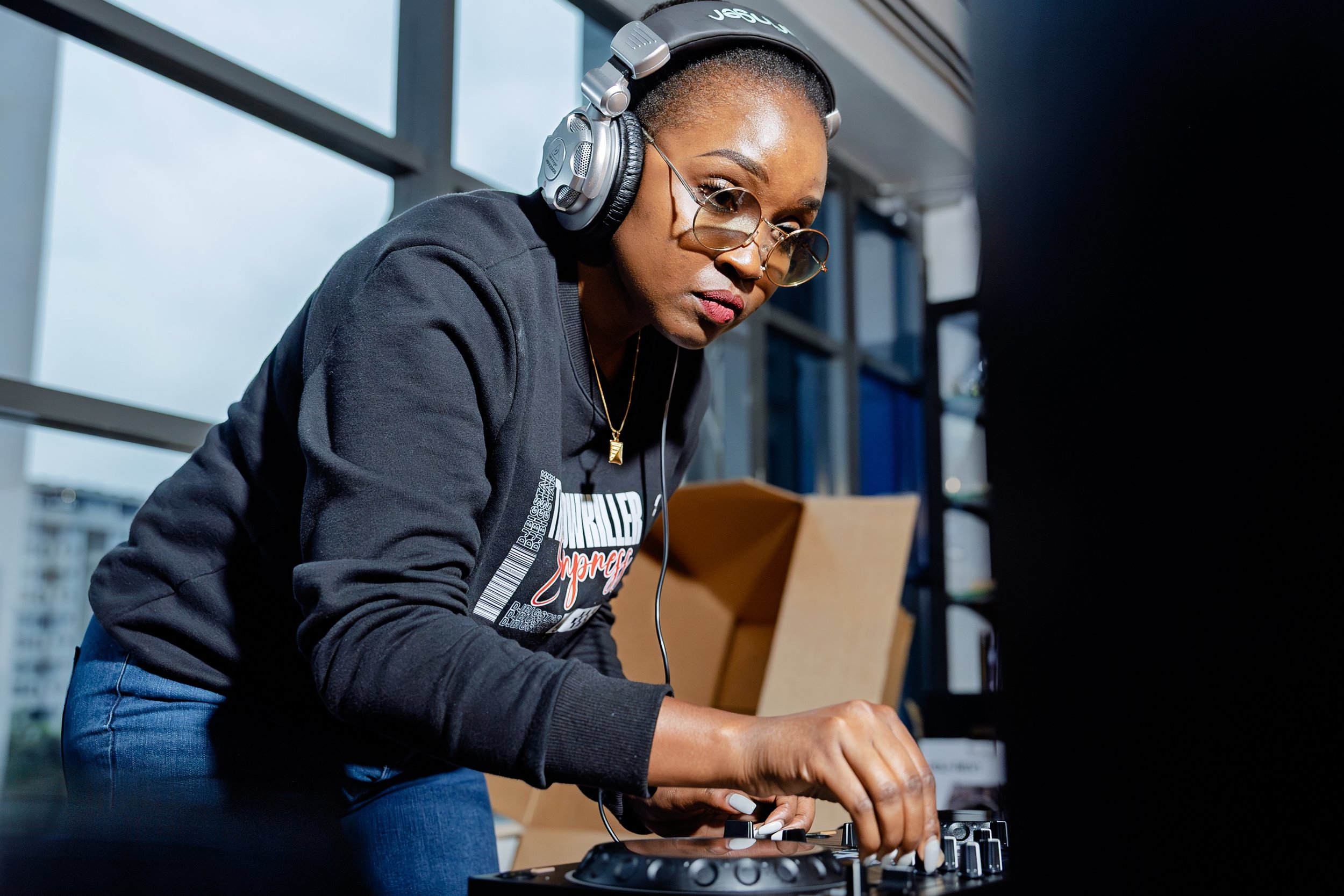 DJ BigStar working at a DJ controller.